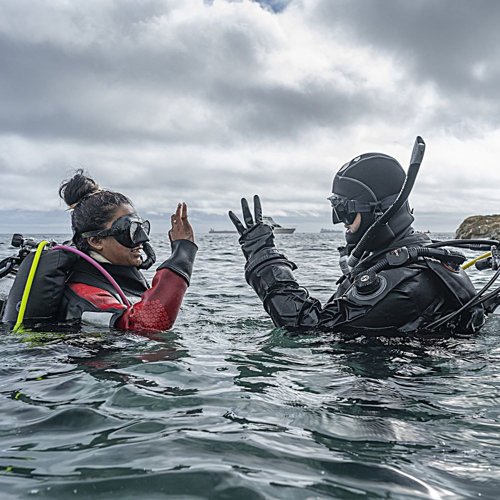 Group of divers at a table after diving